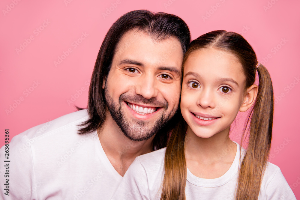 Close up photo beautiful she her little small lady he him his father toothy smile pretty appearance long hairdo hairstyle wear casual white t-shirts denim jeans isolated pink bright background Close up photo beautiful she her little small lady he him his father toothy smile pretty appearance long hairdo hairstyle wear casual white t-shirts denim jeans isolated pink bright background
