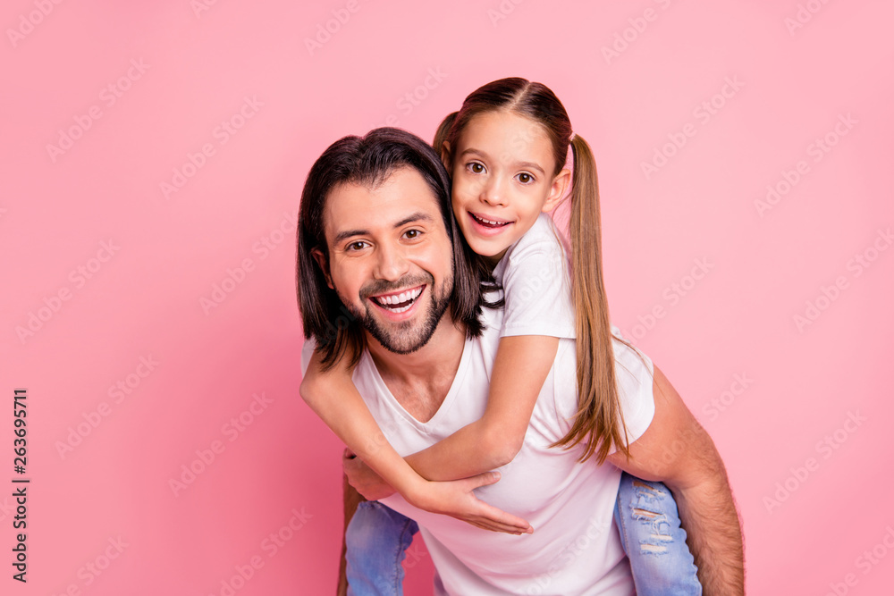 Close up photo beautiful she her little lady he him his daddy dad hold little princess piggy-back hands arms funny funky cheer wear casual white t-shirts denim jeans isolated pink bright background Close up photo beautiful she her little lady he him his daddy dad hold little princess piggy-back hands arms funny funky cheer wear casual white t-shirts denim jeans isolated pink bright background