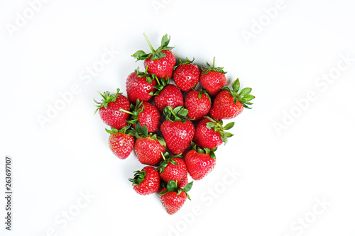 Ripe local produce organic strawberry. Heap of red berries. Fresh healthy vegan dietary food for spring detox. Fruits isolated on white background, top view. Clean eating concept.