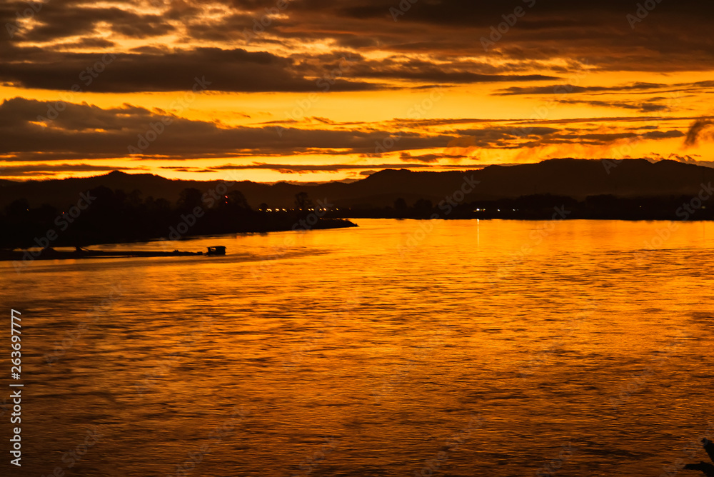 In the morning, the sun rises on the banks of the Mekong River in the Golden Triangle, Chiang Rai, Thailand.