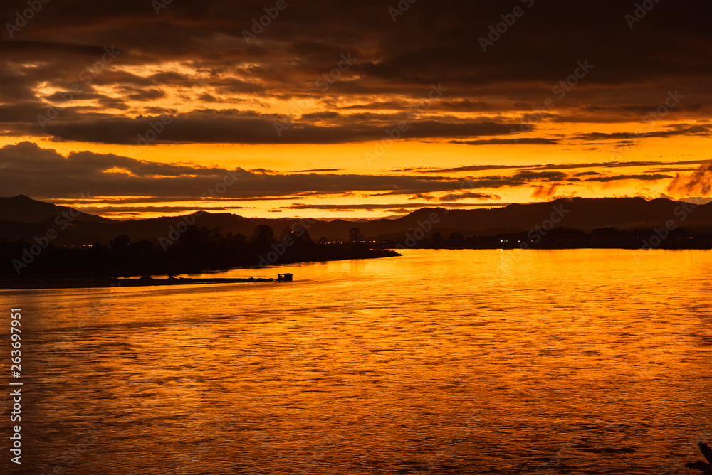 In the morning, the sun rises on the banks of the Mekong River in the Golden Triangle, Chiang Rai, Thailand.