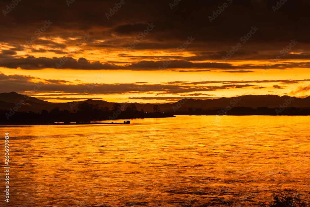 In the morning, the sun rises on the banks of the Mekong River in the Golden Triangle, Chiang Rai, Thailand.