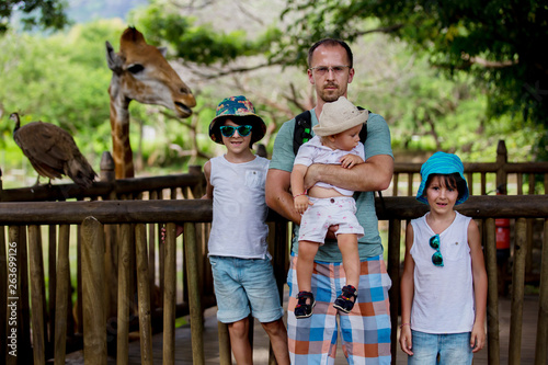 Canvas Print People enjoying giraffes in wild animal safari park