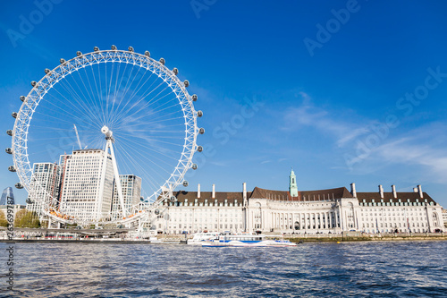 Fototapeta London Eye near County Hall in summer view from Thame river boat cruise
