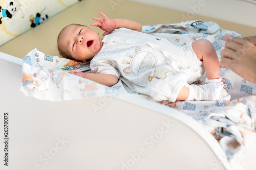 Newborn baby. Little child in medicine hospital. Medical health care. Doctor pediatrician. Small kid, infant in clinic. Healthy little kid shortly after birth photo