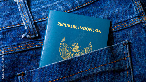 a blue indonesian passport in pocket of jeans - Image