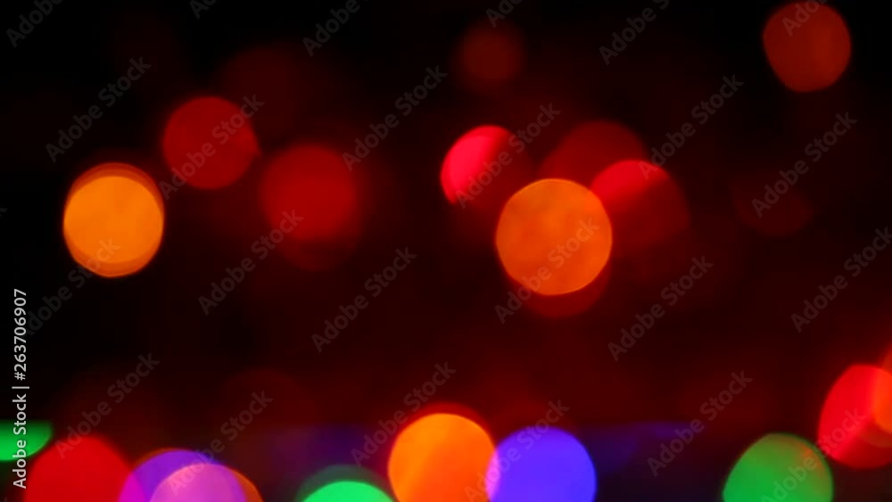 colorful light bokeh blinking on black background colorful light bokeh blinking on black background