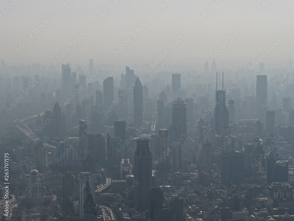 Aerial view of Shanghai city in fog, air pollution is a serious environment problem in China. Aerial view of Shanghai city in fog, air pollution is a serious environment problem in China.