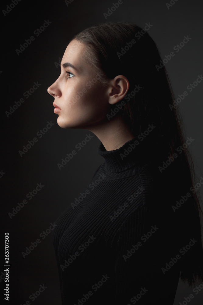 Portrait of a girl in profile. Low key Portrait of a girl in profile. Low key