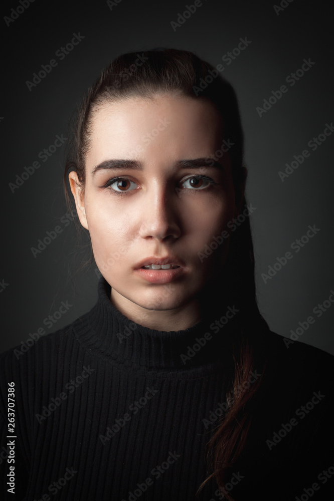 Scared young woman. Studio portrait. Close up Scared young woman. Studio portrait. Close up