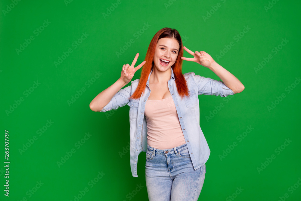 Close up photo beautiful amazing crazy she her foxy lady pretty attractive affectionate adorable show hands arms fingers v-sign say hi wear casual jeans denim shirt isolated green bright background
