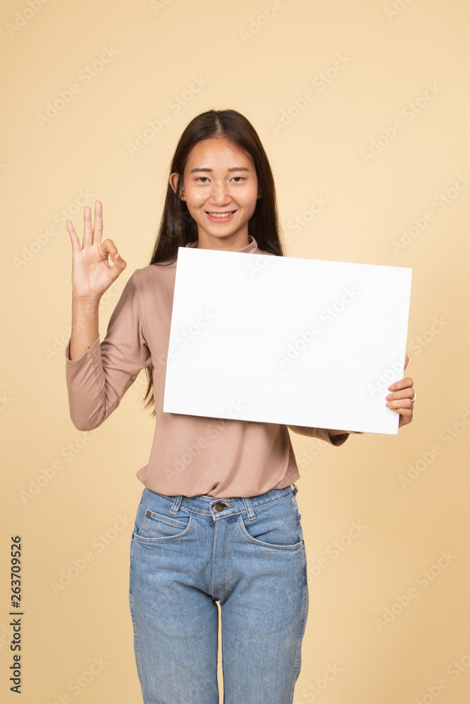 Young Asian woman show OK with white blank sign. Young Asian woman show OK with white blank sign.