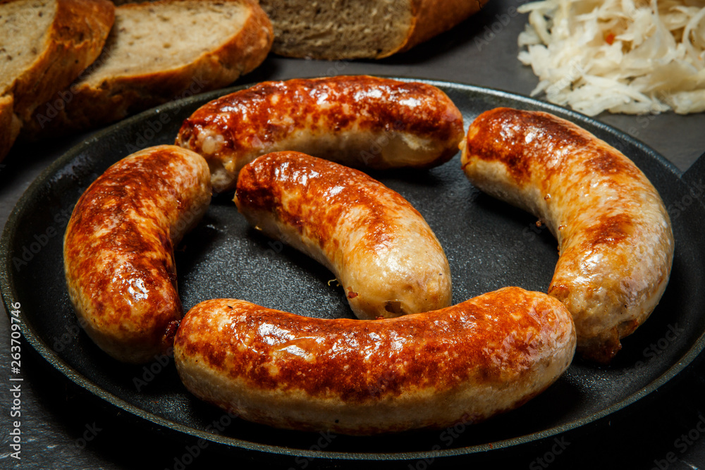 closeup tasty ruddy meat wieners fried in large frying pan closeup tasty ruddy meat wieners fried in large frying pan
