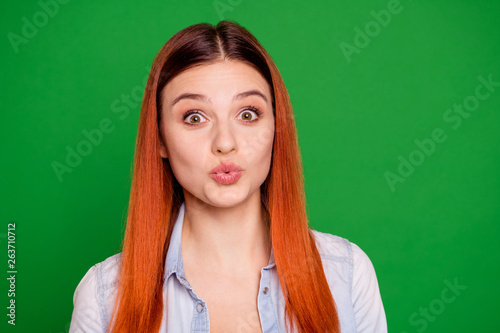 Close up photo attractive lovely teen teenager attract boys men send kisses feel foolish careless have free time weekend holidays hairdo long straight dressed modern jeans isolated green background