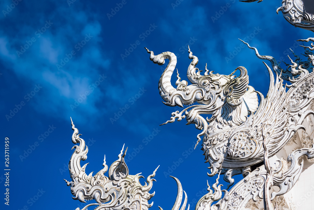 Decoration on top of roof at Wat Rong Khun Chiang Rai province Thailand.