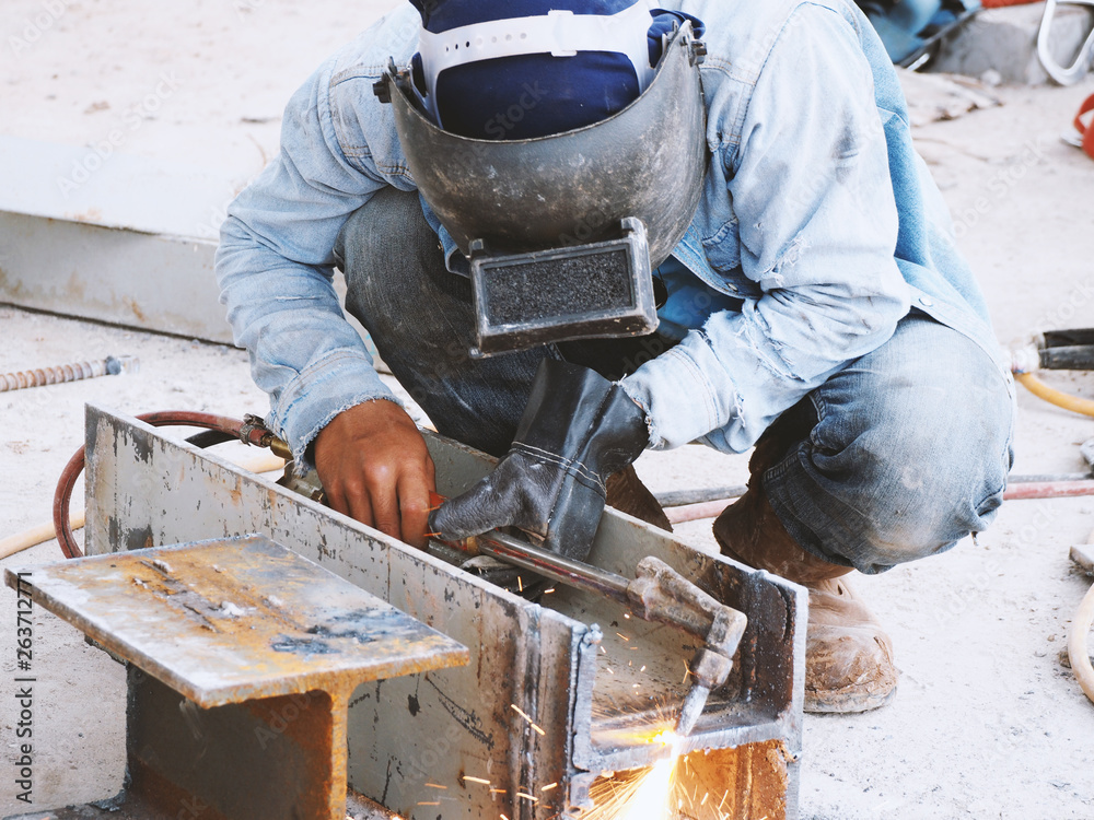 Welding work ,worker with protective welding metal on construction Welding work ,worker with protective welding metal on construction