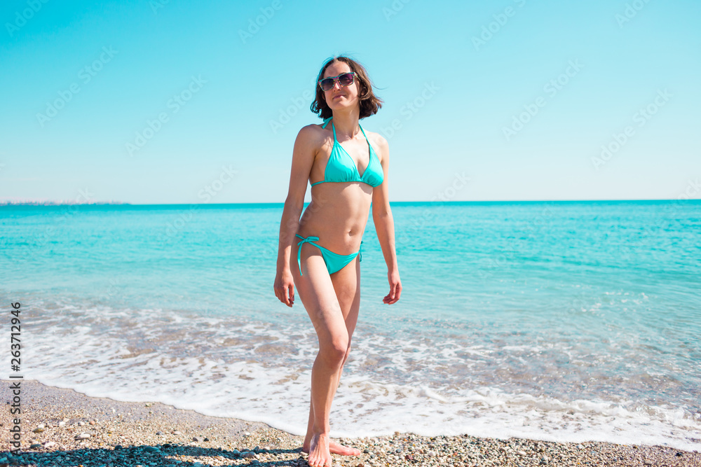 The girl comes out of the water. The girl comes out of the water.