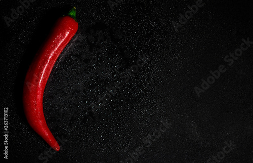 Red hot pepper on black background