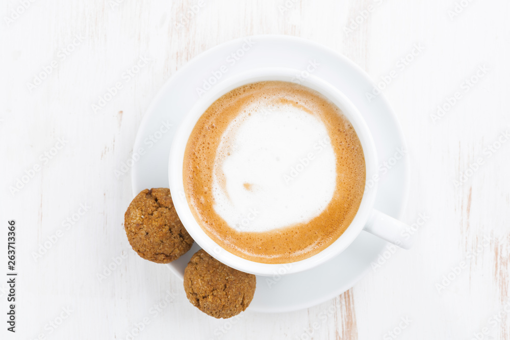 cup of cappuccino and flavored cookies, top view cup of cappuccino and flavored cookies, top view