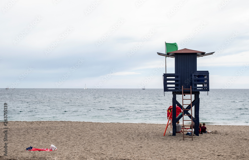 guard house with green flag of lifeguards on a Spanish beach guard house with green flag of lifeguards on a Spanish beach