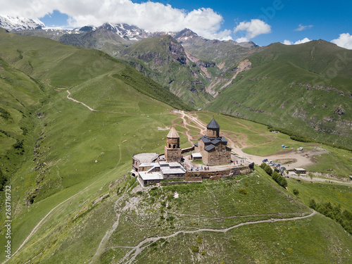 Aerial view to Gergeti Trinity Church or Tsminda Sameba, Holy Trinity Church near the village of Gergeti in Georgia, under Mount Kazbegi