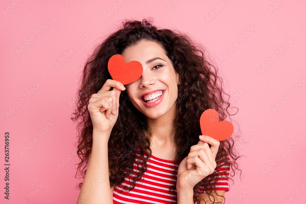 Close-up portrait of her she nice attractive lovely cute charming sweet cheerful cheery glad positive wavy-haired girl holding in hands two little small card isolated over pink pastel background Close-up portrait of her she nice attractive lovely cute charming sweet cheerful cheery glad positive wavy-haired girl holding in hands two little small card isolated over pink pastel background