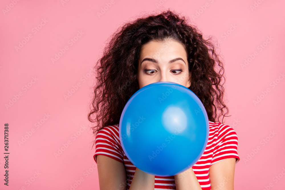 Close-up portrait of her she nice-looking attractive lovely funny funky wavy-haired lady blowing blue ball festal celebratory isolated over pink pastel background Close-up portrait of her she nice-looking attractive lovely funny funky wavy-haired lady blowing blue ball festal celebratory isolated over pink pastel background