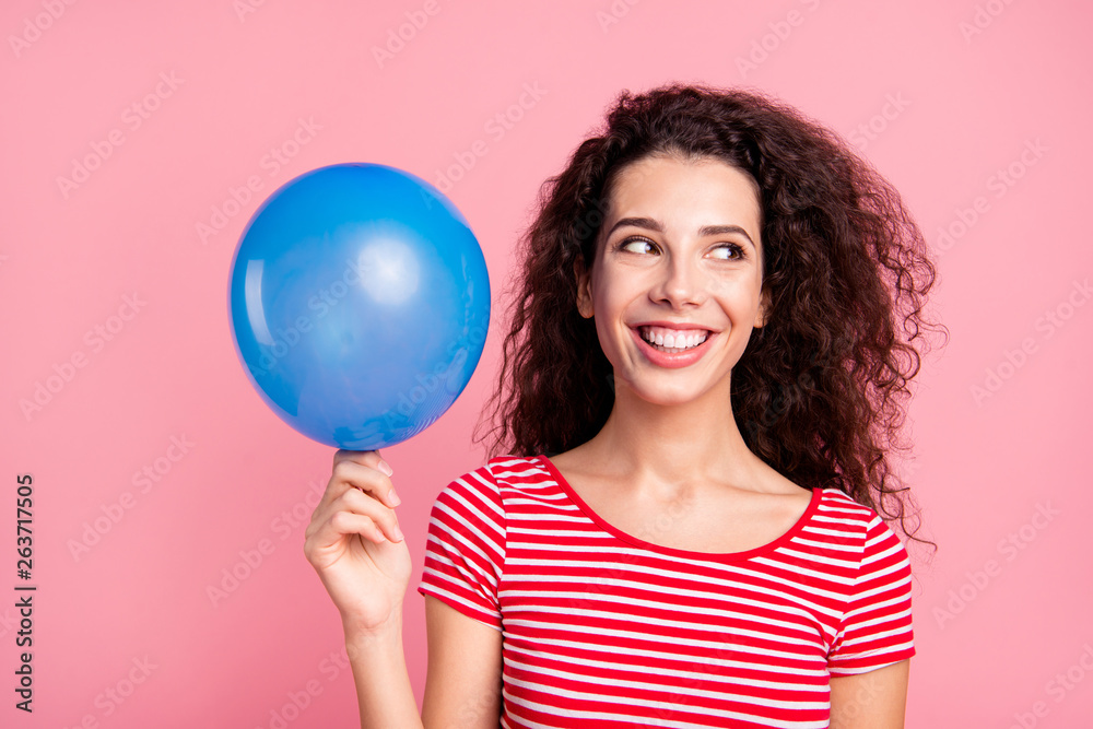 Close-up portrait of her she nice attractive charming lovely cute sweet cheerful cheery wavy-haired lady holding in hand blue ball looking aside isolated over pink pastel background Close-up portrait of her she nice attractive charming lovely cute sweet cheerful cheery wavy-haired lady holding in hand blue ball looking aside isolated over pink pastel background