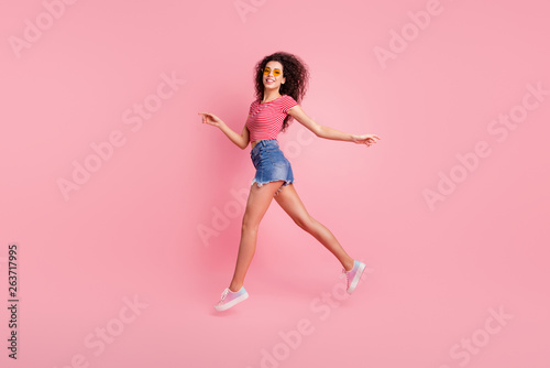 Profile side full length body size view portrait of nice lovely attractive perfect sportive shape form figure cheerful cheery wavy-haired lady jogging strolling isolated over pink pastel background