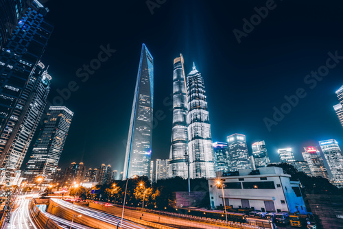 Road City Nightscape Architecture and Fuzzy Car Lights.. photo