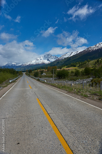 The Carretera Austral  famous road connecting remote towns and villages in northern Patagonia, Chile. Paved section of road running past snow capped mountains near the small town of Cerro Castillo. © JeremyRichards