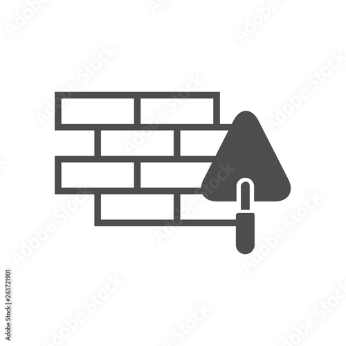 brick wall and trowel vector icon isolated on white background. brick wall and trowel flat icon for web, mobile and user interface design