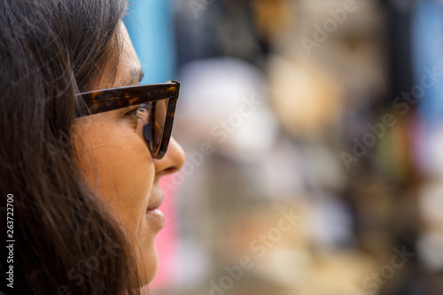 young Indian woman happy looking away