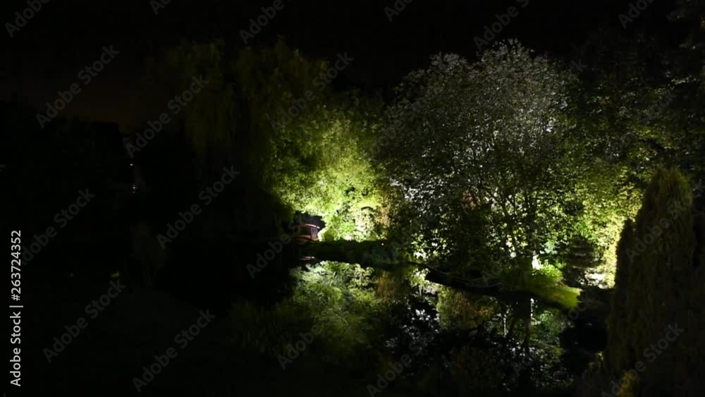 Pan from above over the illuminated park of a large house in Luxembourg Pan from above over the illuminated park of a large house in Luxembourg
