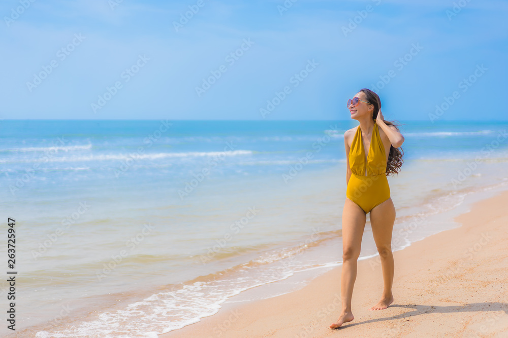 Portrait beautiful young asian woman smile happy on the beach and sea Portrait beautiful young asian woman smile happy on the beach and sea