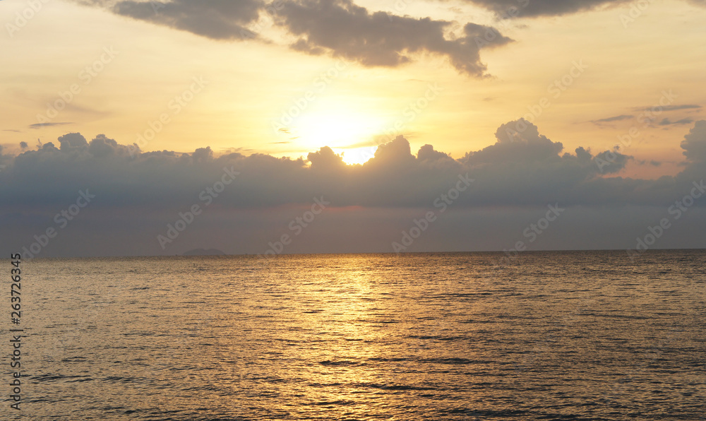 Tropical sunset at sea with clouds