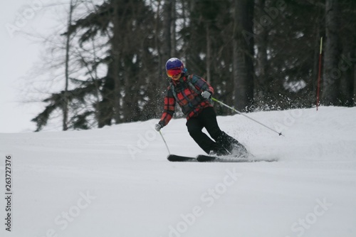 Skier down the snow-covered slopes, Sochi, Russia.