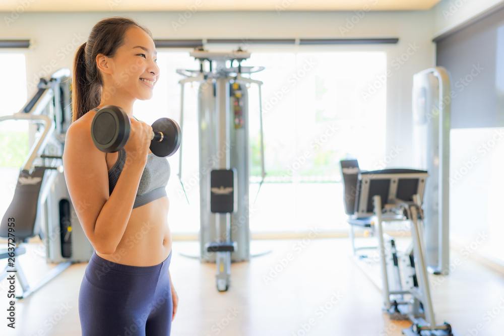 Portrait asian woman exercising and work out in gym Portrait asian woman exercising and work out in gym