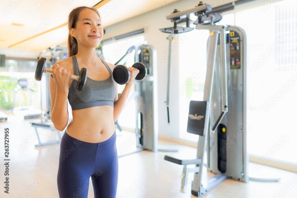 Portrait asian woman exercising and work out in gym Portrait asian woman exercising and work out in gym