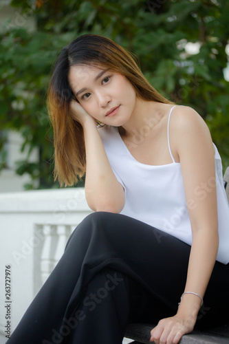 Portrait of thai adult beautiful girl relax and smile