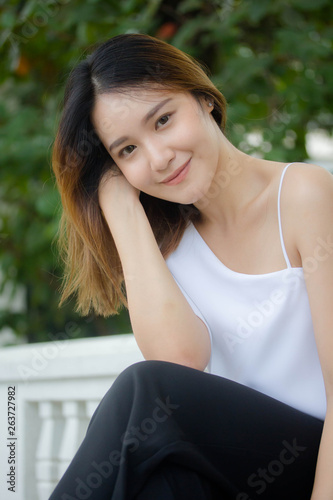 Portrait of thai adult beautiful girl relax and smile