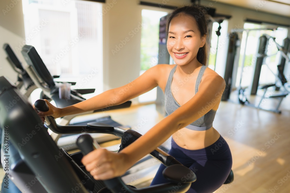 Portrait asian woman exercising and work out in gym Portrait asian woman exercising and work out in gym