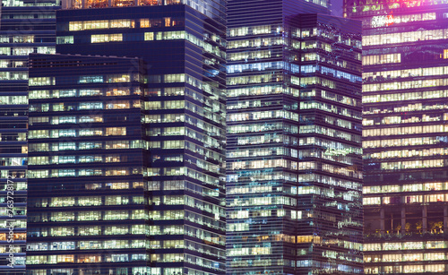 background of skyscrapers windows at night