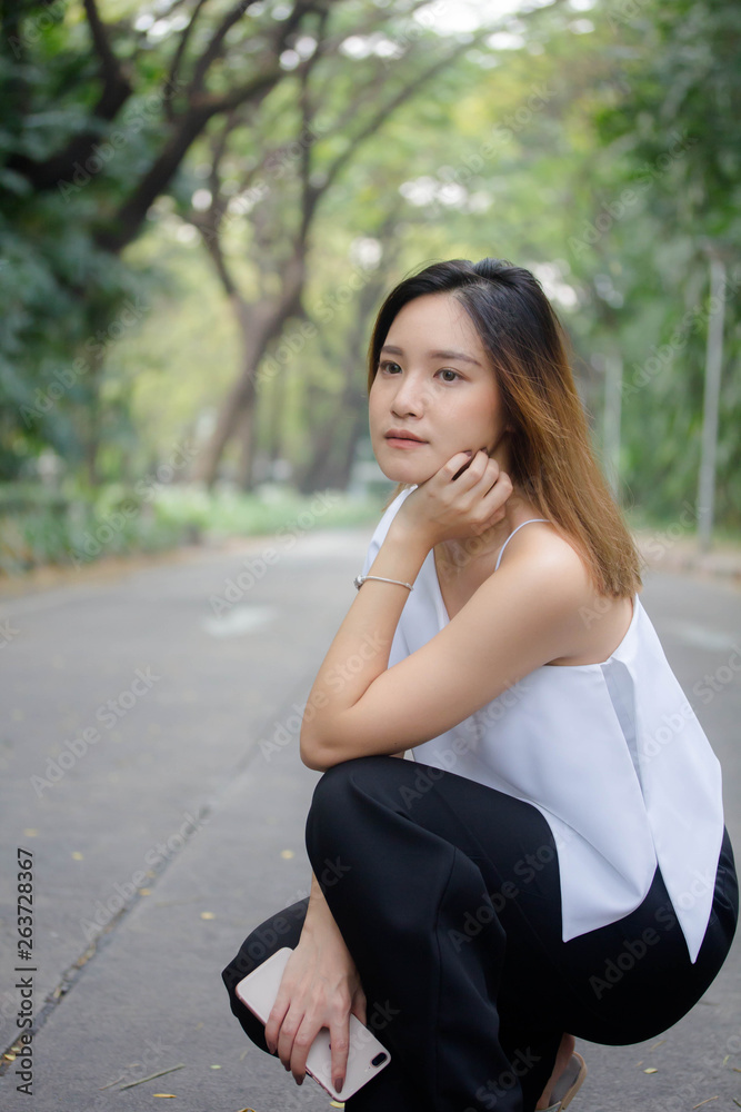 Portrait of thai adult beautiful girl relax and smile Portrait of thai adult beautiful girl relax and smile