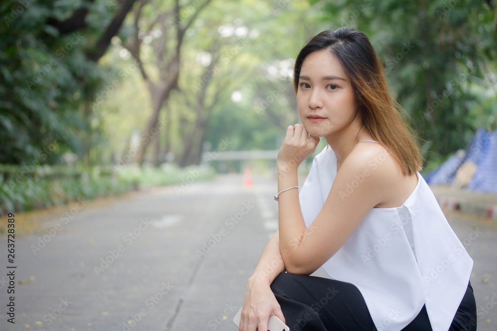 Portrait of thai adult beautiful girl relax and smile Portrait of thai adult beautiful girl relax and smile