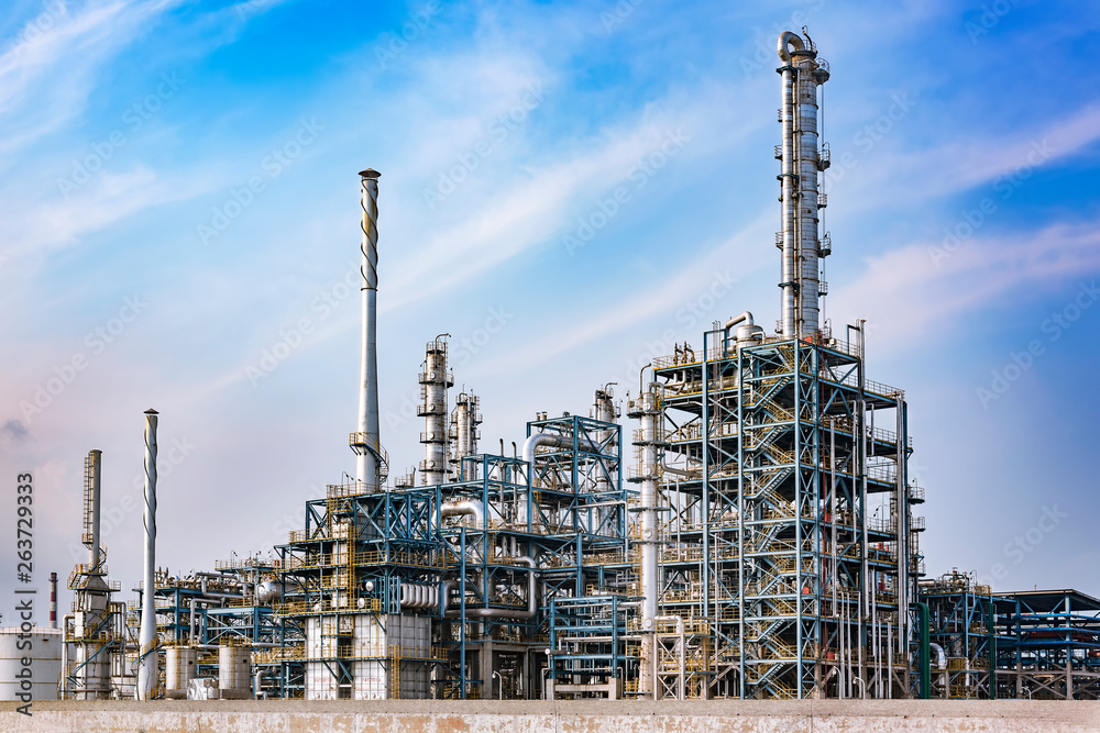Refinery plant under the background of blue sky white clouds Refinery plant under the background of blue sky white clouds
