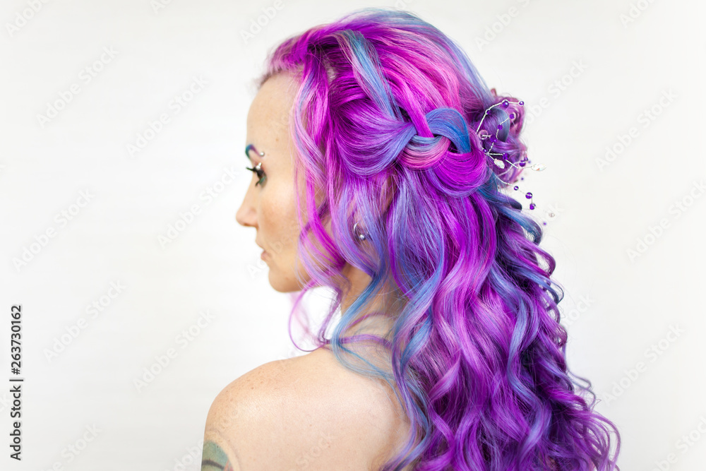 Charming young fashionista with stylish hair. Colored hair Charming young fashionista with stylish hair. Colored hair