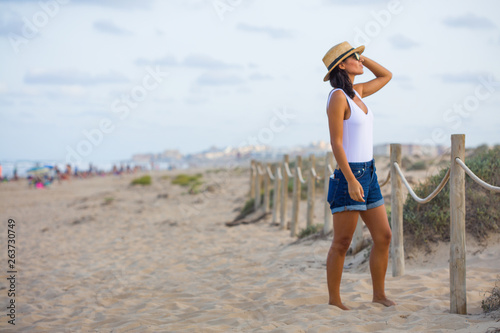 Young indian woman looking aside on the beach