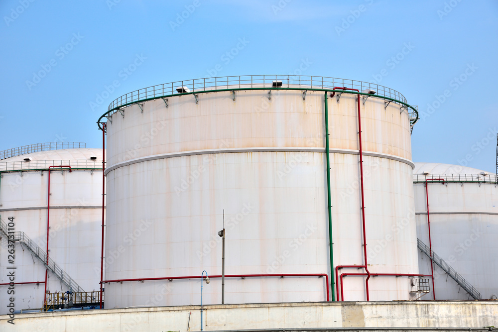 Big white gasoline and oil industry of storage tanks in the blue sky white cloud background