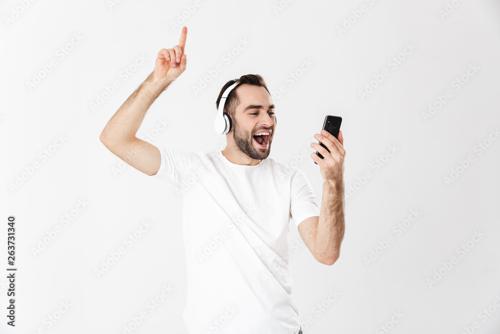 Handsome cheerful man wearing blank t-shirt Handsome cheerful man wearing blank t-shirt